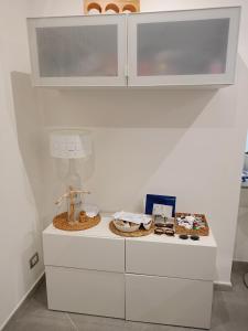 a white counter with cookies and other items on it at Fabian Appartament in Bagheria