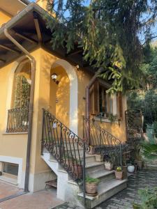 a house with a staircase in front of it at Oasi Gioia verde in Vescia +21 photos