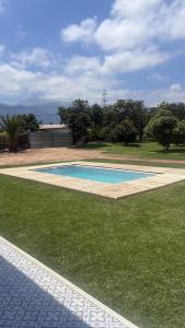 a swimming pool in the middle of a yard at Florencia Boutique Cabin in Olmué