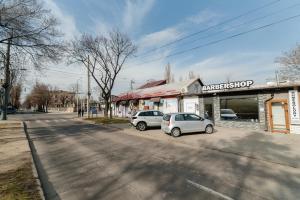 two cars parked on the side of a street at Studio Room Central in Chişinău