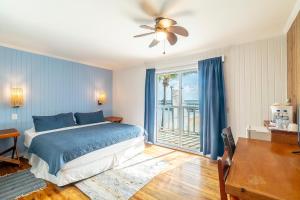a bedroom with a bed and a ceiling fan at Caribbean Villas Hotel in San Pedro +26 photos