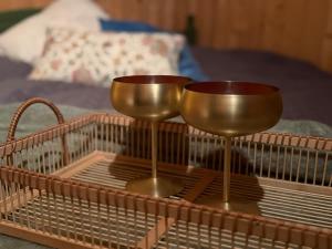 a metal tray with two glasses on top of it at Musekroken in Elverum