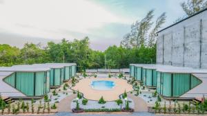 an architectural rendering of a building with a garden at Aqua Soul de Pakbara in Ban Pak Ba Ra