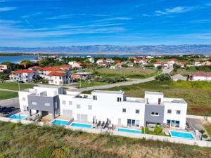 an aerial view of a large white building at Villa Zlata in Privlaka