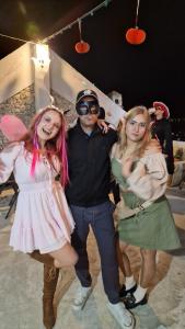 a group of three people dressed up in costumes at Kotor Bay View Apartments in Bijela