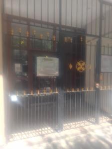 a front door of a building with a gate at Little Bolivar Monoambiente moderno céntrico Escapadas invierno in Mar del Plata