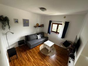 a living room with a couch and a table at Stone house Skrivena in Pridraga