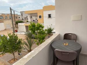 a table and chairs on a balcony with a view at ESSERa in Nouakchott