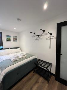 a bedroom with a bed with two towels on it at L'Appartamentino in Cork