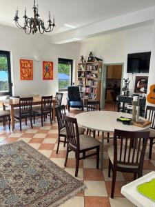 a dining room with a table and chairs at Dom Gościnny Klemens in Dębki