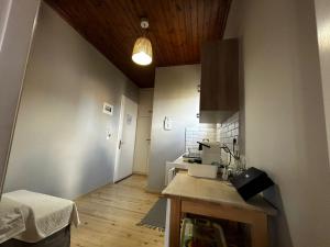 a kitchen with a counter and a table in a room at Tsonas Apartments in Lygia