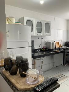 a kitchen with a counter with glasses on it at Ap com 2 quartos climatizados , com fechadura eletrônica, WI-FI ,condomínio Village do bosque 3 in Imperatriz