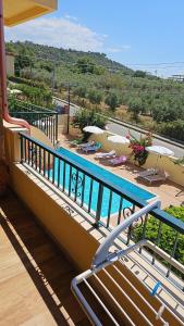 a balcony with a swimming pool on top of a building at Residenza Laura Casa Vacanze Capo Vaticano in Capo Vaticano