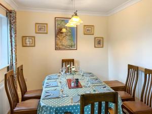 a dining room table with a blue and white table cloth at Number 23 in Wooler