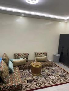 a living room with a couch and a rug at ESSERa in Nouakchott