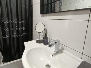 a bathroom with a sink and a mirror at DreamHouse in Jajce +26 photos