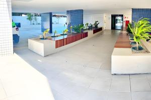 a lobby of an office building with potted plants at Vacanze - Alicante in Maceió +29 photos
