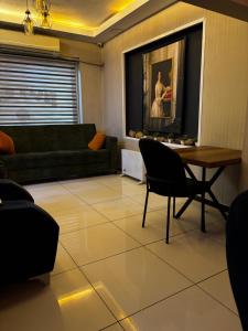 a living room with a couch and a table at Hevsel hotel in Diyarbakır