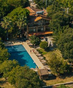 an aerial view of a resort with a swimming pool at Ballı Butik hotel in Kayakoy