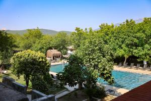 a view of a swimming pool in a resort at Ballı Butik hotel in Kayakoy
