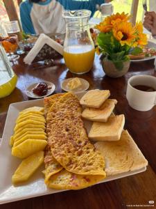 a plate of food with bread and crackers on a table at CAMUNGO jungle Lodge in indigenous community ALL INCLUSIVE in Puerto Franco