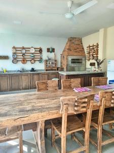 a large wooden table and chairs in a kitchen at La casa de Nimia in Asunción