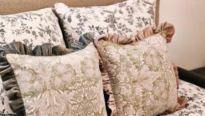 two pillows sitting on top of a bed at Nice apt with parking free in Paris +13 photos