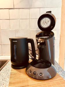 a coffee maker sitting on a counter next to a toaster at Ferienwohnung momentglücklich in Eggingen in Eggingen