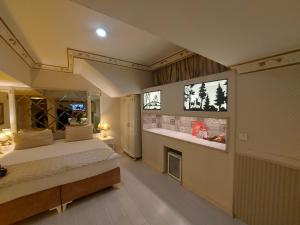 a bedroom with a bed and a fireplace in it at Leyenda Boutıque Hotel in Istanbul