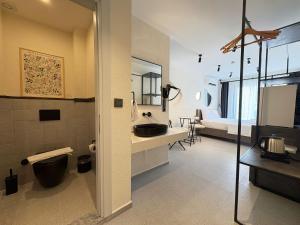a bathroom with a sink and a toilet at Arıcan Pansiyon in Fethiye