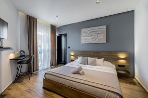a bedroom with a large bed with a wooden headboard at Beachfront Luxury Villa in Vinišće +44 photos