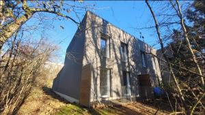 an old white house in the woods at Chambre proche Zénith et Centre ville in Nancy