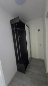 a black elevator in an empty room at Hostel istaba in Rēzekne