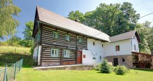 a large wooden house in a field at Chalupa Žernovka in Žernov +23 photos