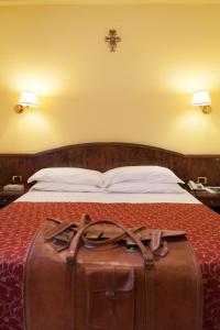 Ένα ή περισσότερα κρεβάτια σε δωμάτιο στο Hotel Villa Elda