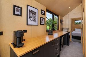 a room with a coffee machine on a counter at Tiny on Access in Kerikeri