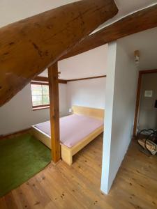 a bedroom with two bunk beds in a attic at Apartmány Dolní Vítkov in Chrastava