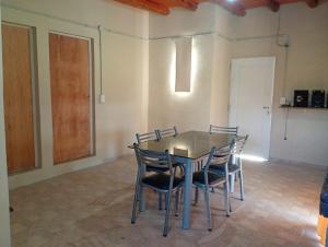 a dining room with a table and chairs at Casa de luna in San Lorenzo