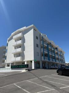 a parking lot in front of a building at Brezza Marina - Vacation Condo in Marina di Vasto