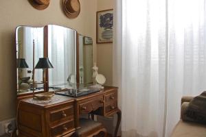 a dressing table with a mirror on top of it at Casa Côrte Real in Porto