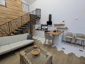 a living room with a couch and a table at Forest House Chalet Bran in Predeluţ