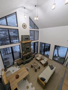 an aerial view of a living room with a fireplace at Forest House Chalet Bran in Predeluţ