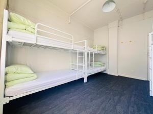 a bunk bed room with two bunk beds at Utopia31 Hostel - formerly Frienz Backpacker in Auckland