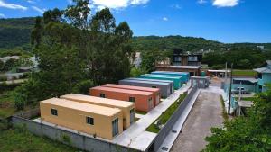 an overhead view of a group of buildings in a town at Villammare Cachoeira in Florianópolis
