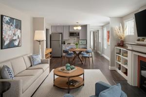 a living room with a couch and a table at Epicurean Hotel, Autograph Collection in Tampa