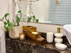 a bathroom counter with wooden boxes and a sink at Boho studio in Amman +14 photos