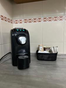 a trash can sitting in a bathroom with a basket at Casa Ponte in Ponte San Giovanni