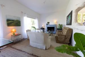 a living room with a couch and a fireplace at Casa Blue3 in Punta del Este