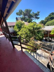 a wooden fence sitting on top of a porch at La Nueva Vecindad in San Bernardo
