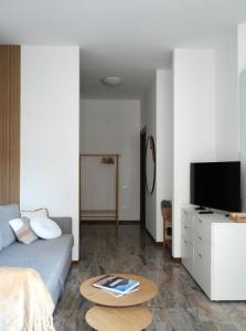 a living room with a couch and a table at UNIque Apt Bergamo 2 in Bergamo